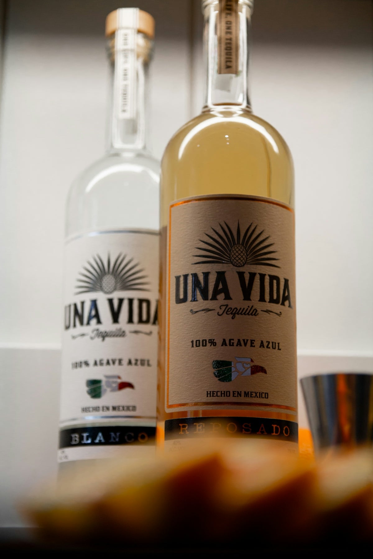 a couple of bottles of alcohol sitting on top of a counter