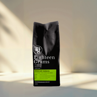 Thumbnail for Black coffee bag labeled 'Eighteen Grams' on a neutral background mexican coffee beans 250g 