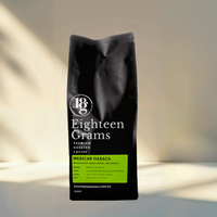 Thumbnail for Black coffee bag labeled 'Eighteen Grams' on a neutral background Mexican