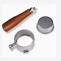 Thumbnail for Coffee brewing tool set with wooden handle, metal filter, and metal collar on a white background