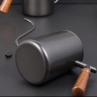 Thumbnail for Metal coffee scoop with wooden handle on a dark surface
