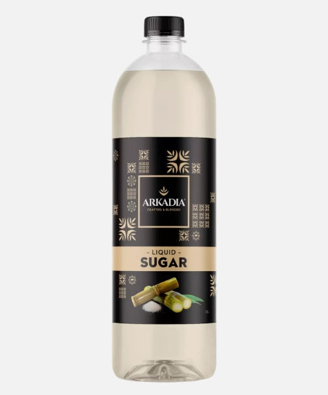 Bottle of liquid sugar with a black and gold label on a white background