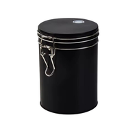 Thumbnail for A black cylindrical metal canister with a screw-top lid, two silver metal bands, and a silver clamp closure on the front, shown on a plain white background.