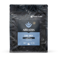 Thumbnail for Pack of Arkadia Earl Grey pyramid tea bags with a dark leaf pattern on a white background