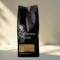 Thumbnail for Black coffee bag with 'Eighteen Grams' branding on a gradient background. Blend 213.