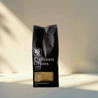 Thumbnail for Black coffee bag labeled 'Eighteen Grams' on a light background. 250G blend 213.