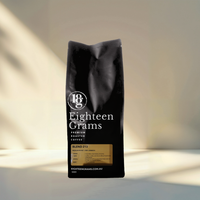 Thumbnail for Black coffee bag with 'Eighteen Grams' branding on a neutral background