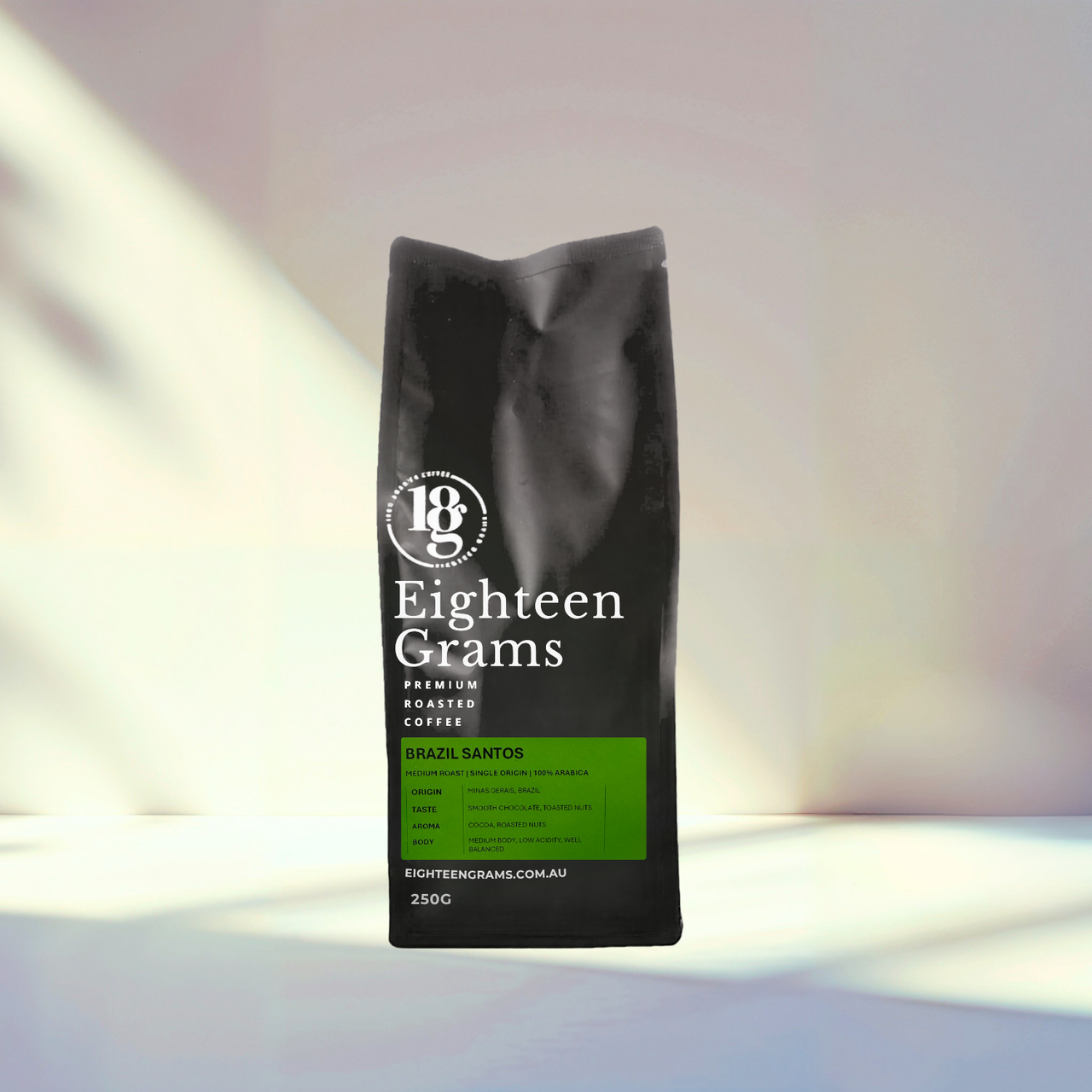 Black coffee bag labeled 'Eighteen Grams' on a white background