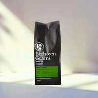 Thumbnail for Black coffee bag labeled 'Eighteen Grams' on a white background