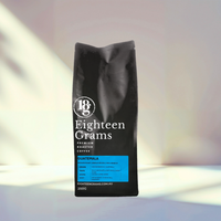 Thumbnail for Black coffee bag labeled 'Eighteen Grams' on a white background