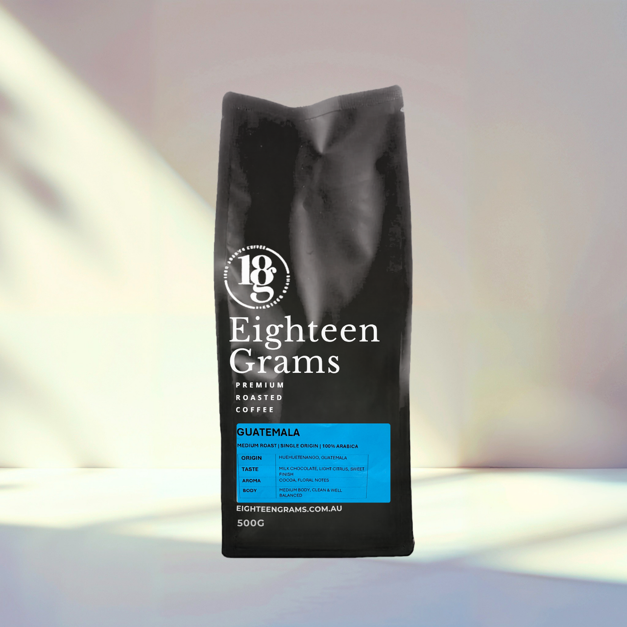 Black coffee bag with 'Eighteen Grams' branding on a gradient background Guatemala-Huehuetenango-Single-Origin-Coffee-eighteengrams