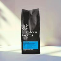 Thumbnail for Black coffee bag with 'Eighteen Grams' branding on a gradient background Guatemala-Huehuetenango-Single-Origin-Coffee-eighteengrams