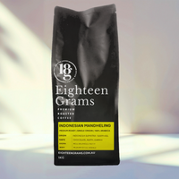 Thumbnail for Black coffee bag labeled 'Eighteen Grams' on a light background