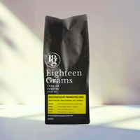 Thumbnail for Black coffee bag labeled 'Eighteen Grams' on a gradient background