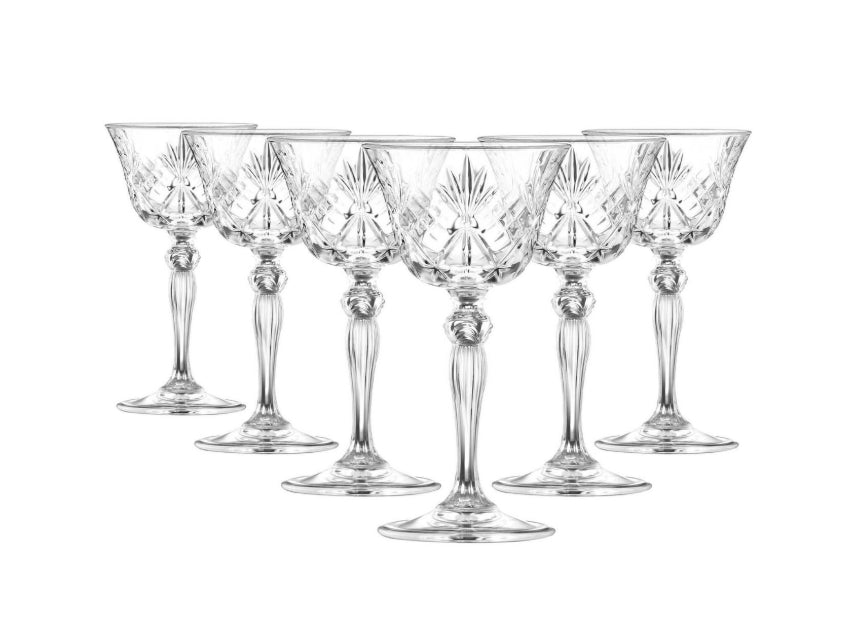 Set of six crystal wine glasses on a white background