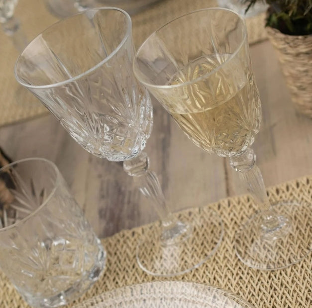 Set of crystal wine glasses on a textured surface
