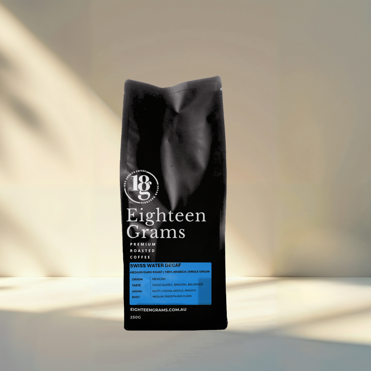 Black coffee bag labeled 'Eighteen Grams' on a light background