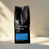 Thumbnail for Black coffee bag with 'Eighteen Grams' branding on a neutral background