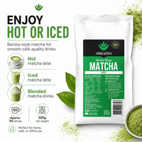 Thumbnail for A 500g bag of Arkadia Barista Range Matcha Latte shown on a white background with promotional text, matcha green powder, tea leaves, and a small bowl of matcha. The package is white with a black and green label.