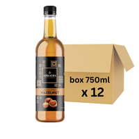 Thumbnail for A bottle of Arkada Hazelnut syrup 
next to a brown cardboard shipping box with text reading 'box 750ml x 12' on a plain white background.