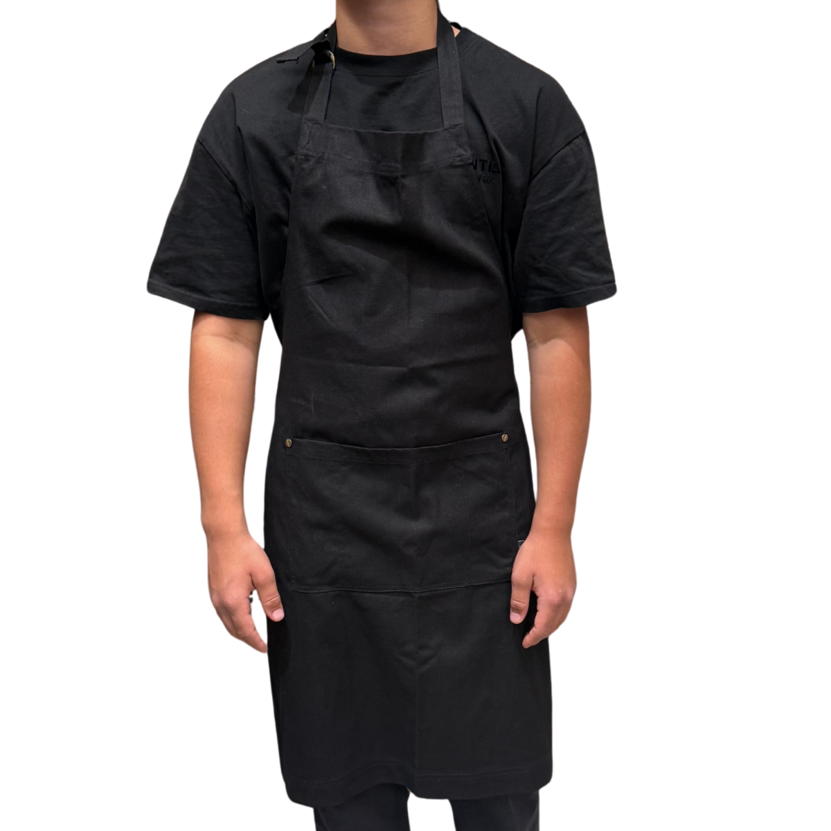 Person wearing a black apron on a white background