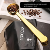 Thumbnail for Gold coffee scoop with beans and clip on a coffee bag