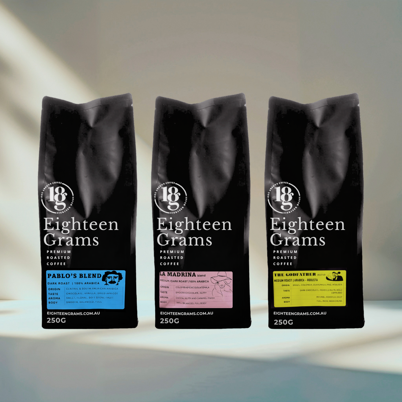 Three black coffee bags labeled 'Eighteen Grams' on a light background. Capo Legacy 3 x 250g packs includes Pablos, LA madrina, and Godfather Blends 