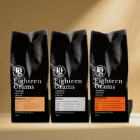 Thumbnail for Three black coffee bags from Eighteen Grams on a beige background.Coffee Taster Set – 3 Pack Fresh Roasted Coffee Beans