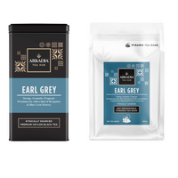 Thumbnail for Arkadia Tea Hub Earl Grey tea packaging including a metal tin and pyramid tea bags on a white background.