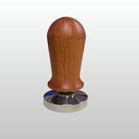 Thumbnail for A coffee tamper with a polished reddish-brown wooden handle and a shiny silver metal circular base, shown against a light gray gradient background.
