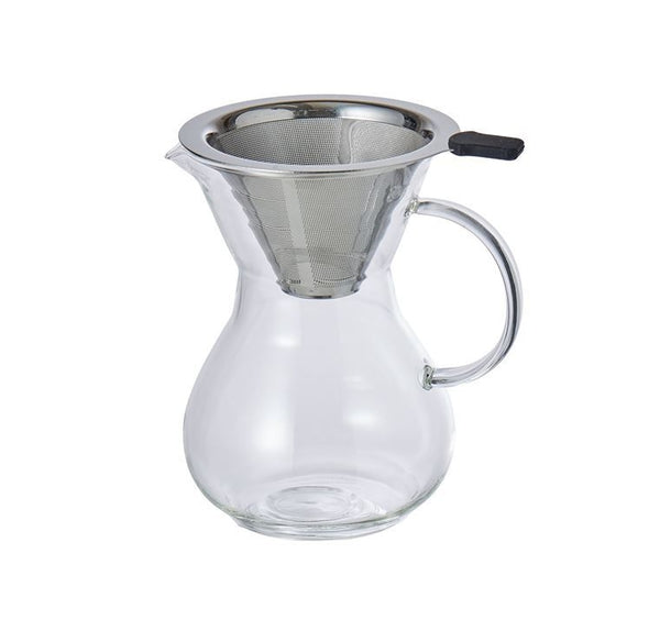 Clear glass pitcher with metal filter on a white background