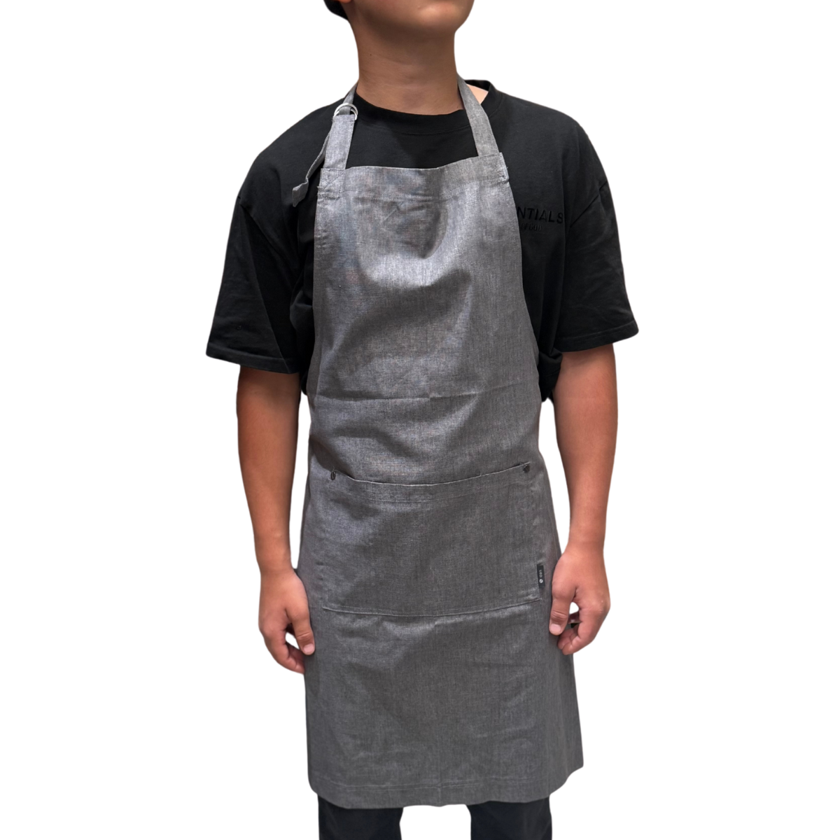Person wearing a gray apron on a white background