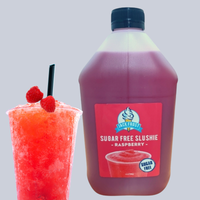 Thumbnail for Bottle of Jack Frost Sugar Free Raspberry Slushie next to a glass of slushie on a gray background