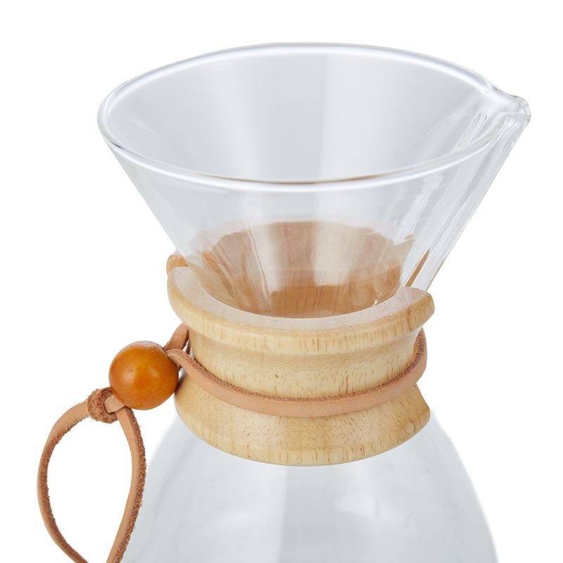 Clear glass coffee maker with wooden collar and handle on a white background