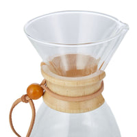 Thumbnail for Clear glass coffee maker with wooden collar and handle on a white background