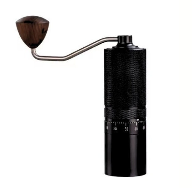Black manual coffee grinder with wooden handle on a white background