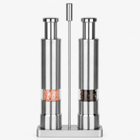 Thumbnail for Silver pepper mill and salt shaker set on a white background