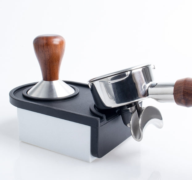 Coffee tamp and scoop set on a white background