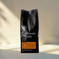 Thumbnail for Black coffee bag labeled 'Eighteen Grams' on a neutral background. Roasters Blend – Medium Roast Coffee Beans – 500g