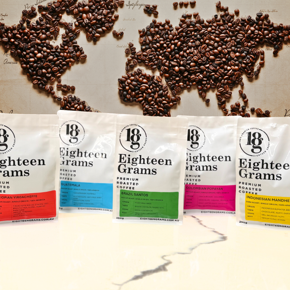 Coffee bean packages labeled 'Eighteen Grams' arranged on a world map background.