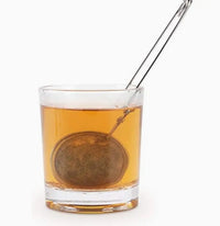 Thumbnail for Tea ball in a glass of tea on a white background