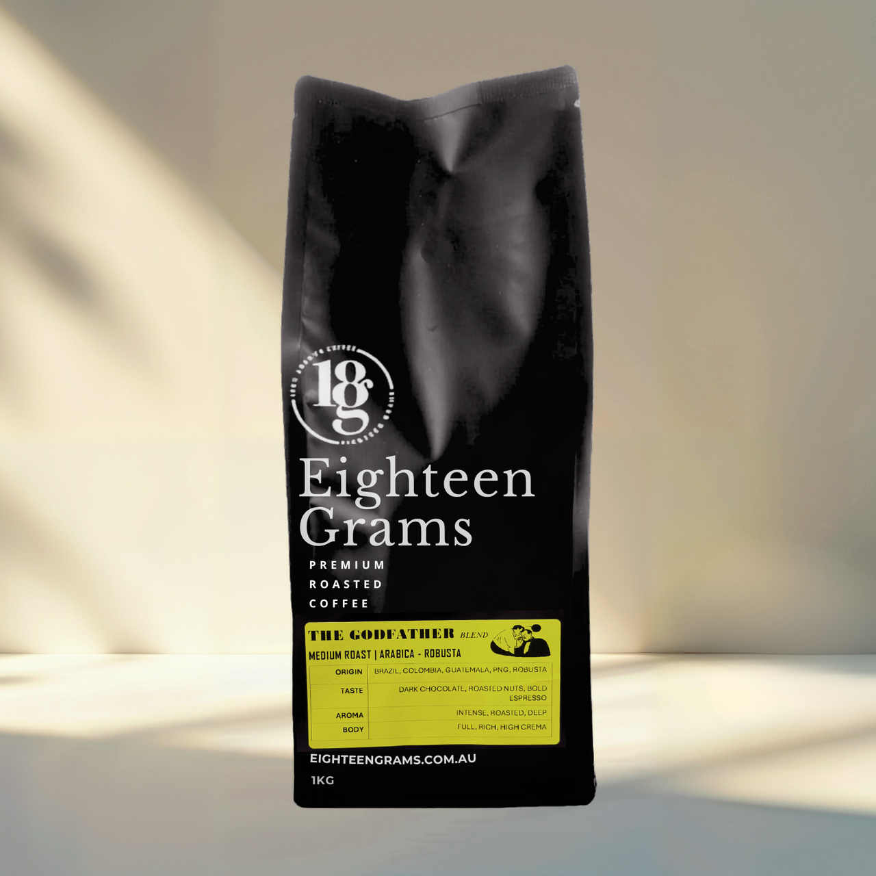 Black coffee bag with 'Eighteen Grams' branding on a neutral background. the-godfather-blend-medium-roast-coffee-beans-1kg