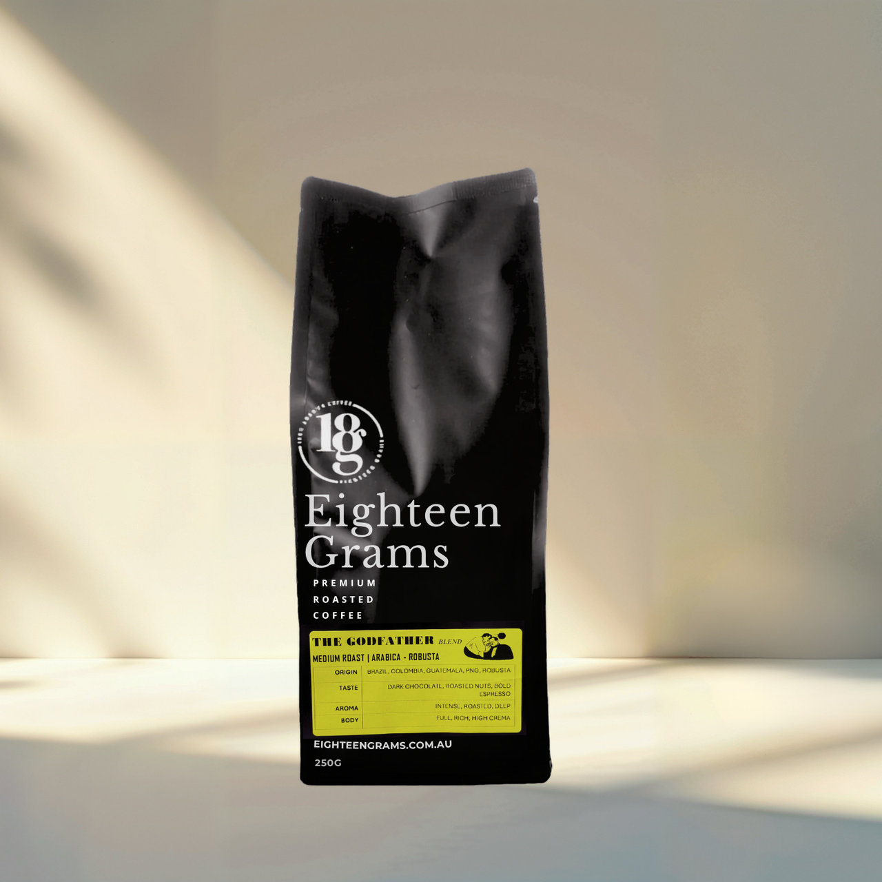 Black coffee bag with 'Eighteen Grams' branding on a gradient background. the-godfather-blend-medium-roast-coffee-beans-250g