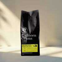 Thumbnail for Black coffee bag with 'Eighteen Grams' branding on a neutral background.the-godfather-blend-medium-roast-coffee-beans-500g